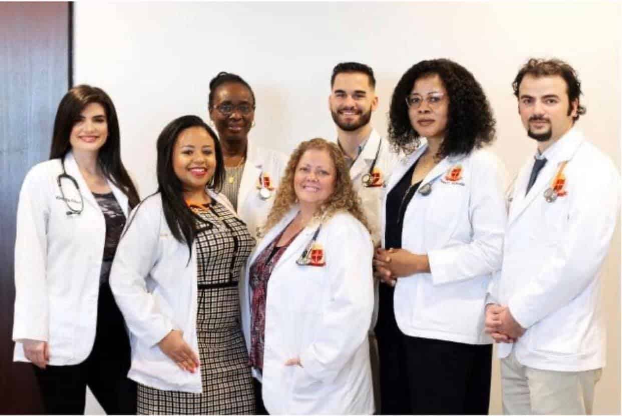 Members of the Georgetown American University clinical community in white coats